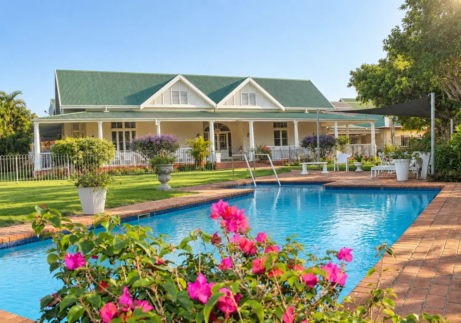 Swimming pool with clubhouse beyond